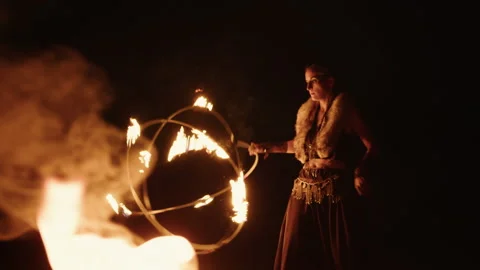 Firedancer performs at night, revolving sphere Video stock 228083956