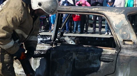 Firefighers cutting the with a hydraulic rescue cutter at a extrication Stock Footage 62852508