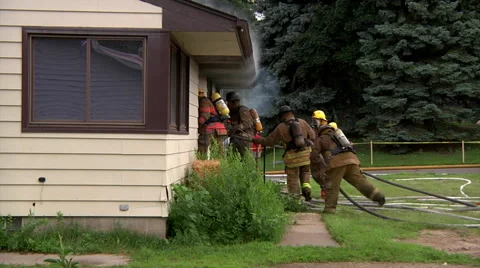 Firefighers Enter House Video stock 46970681