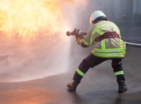 Firefighter in action Stock Photos