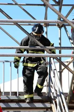 Firefighter in Action on Training Structure Stock Photos