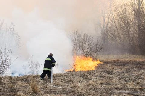 Firefighter battle a wildfire Stock Photos