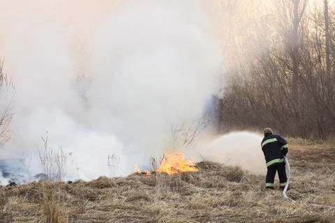 Firefighter battle a wildfire Stock Photos