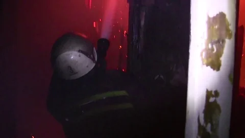 Firefighter battling with the fire in the building, firefighter with a hose Video stock 71326645