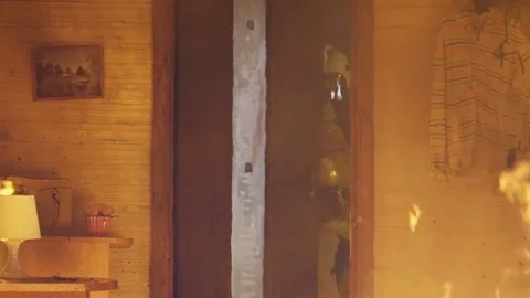 A firefighter in a burning building Vidéo 72317532