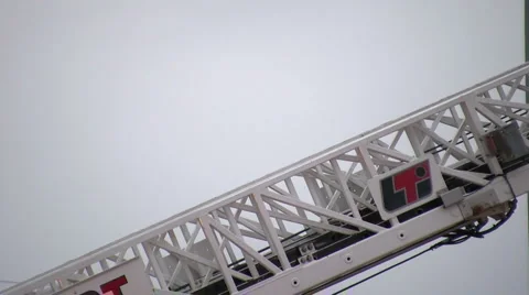 Firefighter climbs down ladder Stock Footage 1671394