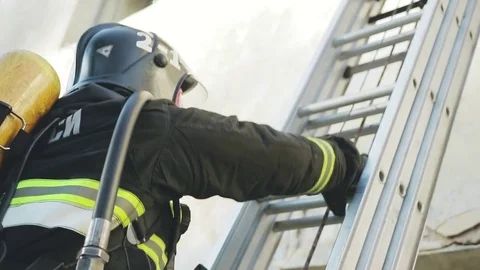 The firefighter climbs the stairs Stock Footage 76850458