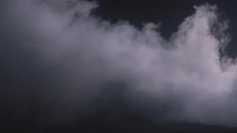 Firefighter combating a fire. Fireman putting out a burning car on flames with Stock Footage 220485145
