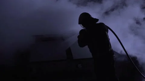 Firefighter combating flames. Fireman putting out a car fire. Burning car. Big Vídeos de archivo 220429729