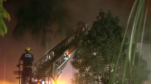 Firefighter coming down ladder Stock Footage 936316