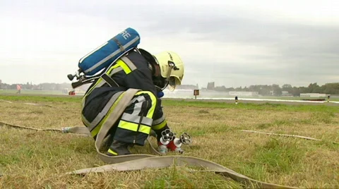 Firefighter connecting hose Stock Footage 637526