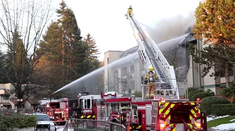 Firefighter crews battling apartment complex fire Stock Footage 47731581