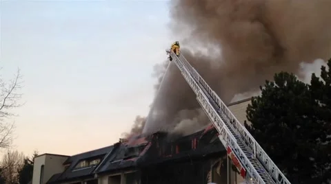 Firefighter crews battling apartment complex fire Stock Footage 57415371