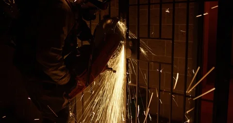 Firefighter cutting steel gate in a training course Stock Footage 107625516
