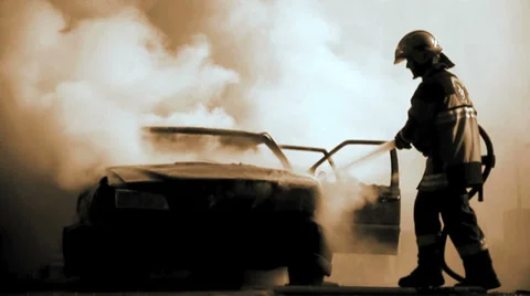 Firefighter deleting burning car background. car on fire. emergency disaster Stock Footage 37268991