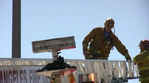 Firefighter descends a ladder Video stock 5186023