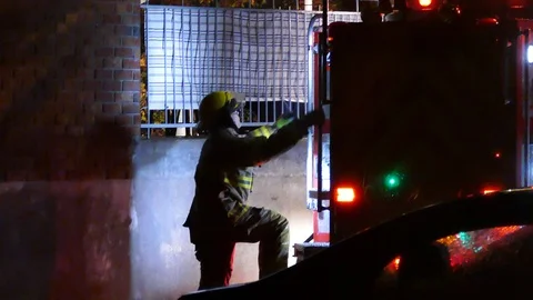 Firefighter escalading firetruck Stock Footage 120163873