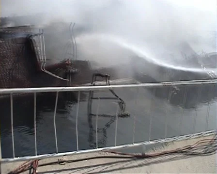 Firefighter extinguishes a fire Stock Footage 930407