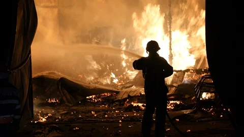 Firefighter Extinguishing A Fire Stock-Footage 91332691