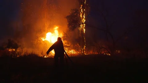 Firefighter fighting with bush fire Stock Footage 40430924