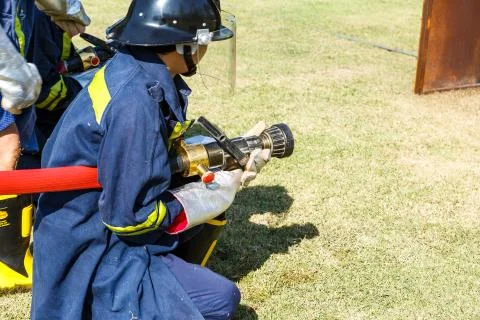 Firefighter fighting for fire attack training Stock Photos