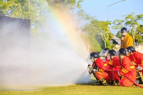 Firefighter fighting for fire attack training Stock Photos