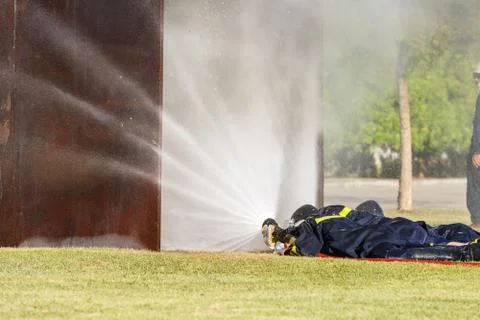 Firefighter fighting for fire attack training Stock Photos