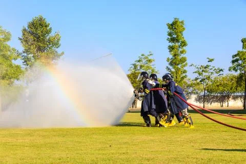 Firefighter fighting for fire attack training Stock Photos