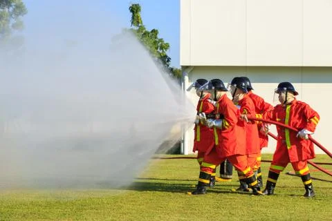 Firefighter fighting for fire attack training Stock Photos