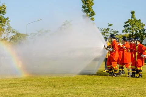 Firefighter fighting for fire attack training Stock Photos