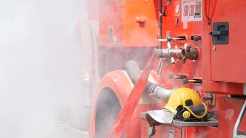 Firefighter fighting with fire flame protection property. Fireman wear hard hat, Video stock 124123056