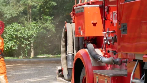 Firefighter fighting with fire flame protection property Stock Footage 270104477