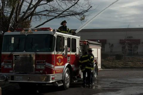 Firefighter fighting Fire Stock Photos