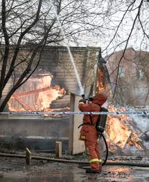 Firefighter Fighting Fire Foto stock