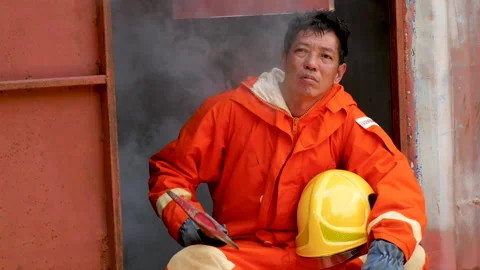 Firefighter fighting with flame using fire hose chemical water foam spray engin Video stock 254135294