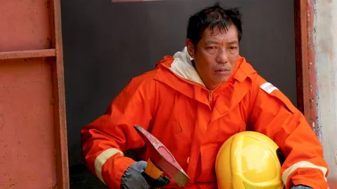 Firefighter fighting with flame using fire hose chemical water foam spray engin Vídeo Stock 254135329