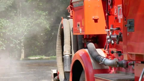Firefighter fighting with flame using fire hose chemical water foam 動画素材 337748350