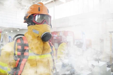 Firefighter fighting forest fire Stock Photos