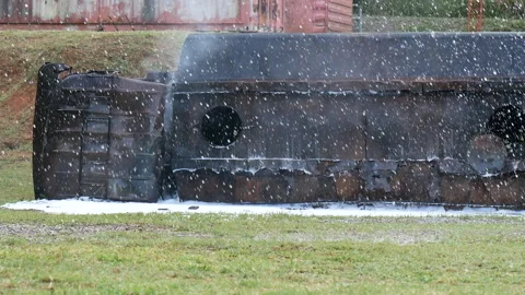 Firefighter fighting smoke flame use fire hose chemical water foam spray engine. Video stock 279960073