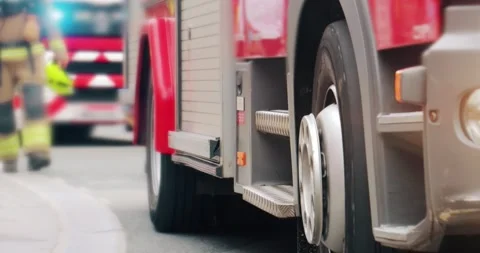Firefighter by fire truck emergency services vehicle Stock Footage 342680285