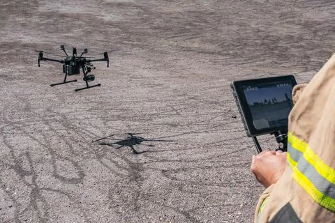 Firefighter flying rescue drone Stock Photos