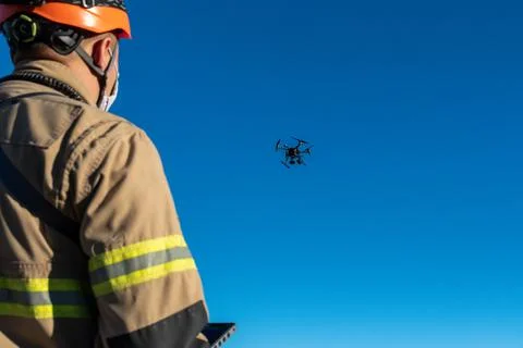 Firefighter flying rescue drone Stock Photos