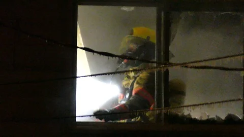 Firefighter in freezing temperature Stock Footage 125419052