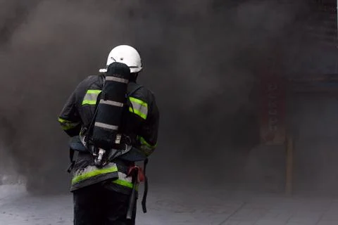 Firefighter, going in a fire. Stock Photos