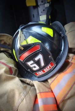 Firefighter hat helmet on jacket Photos
