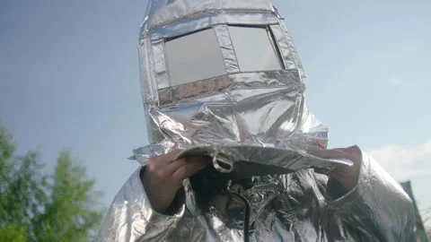 A firefighter in a heat-reflective suit Stock Footage 240700546