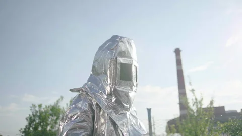 A firefighter in a heat-reflective suit Stock Footage 240700584