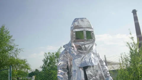 A firefighter in a heat-reflective suit Stock Footage 240700608
