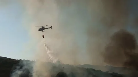 Firefighter Helicopter Dropping Water. Wildfire Stock Footage 157775434