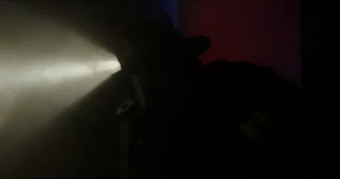 Firefighter Makes Entry Into Burning Industrial Building at Night Stock Footage 247403510